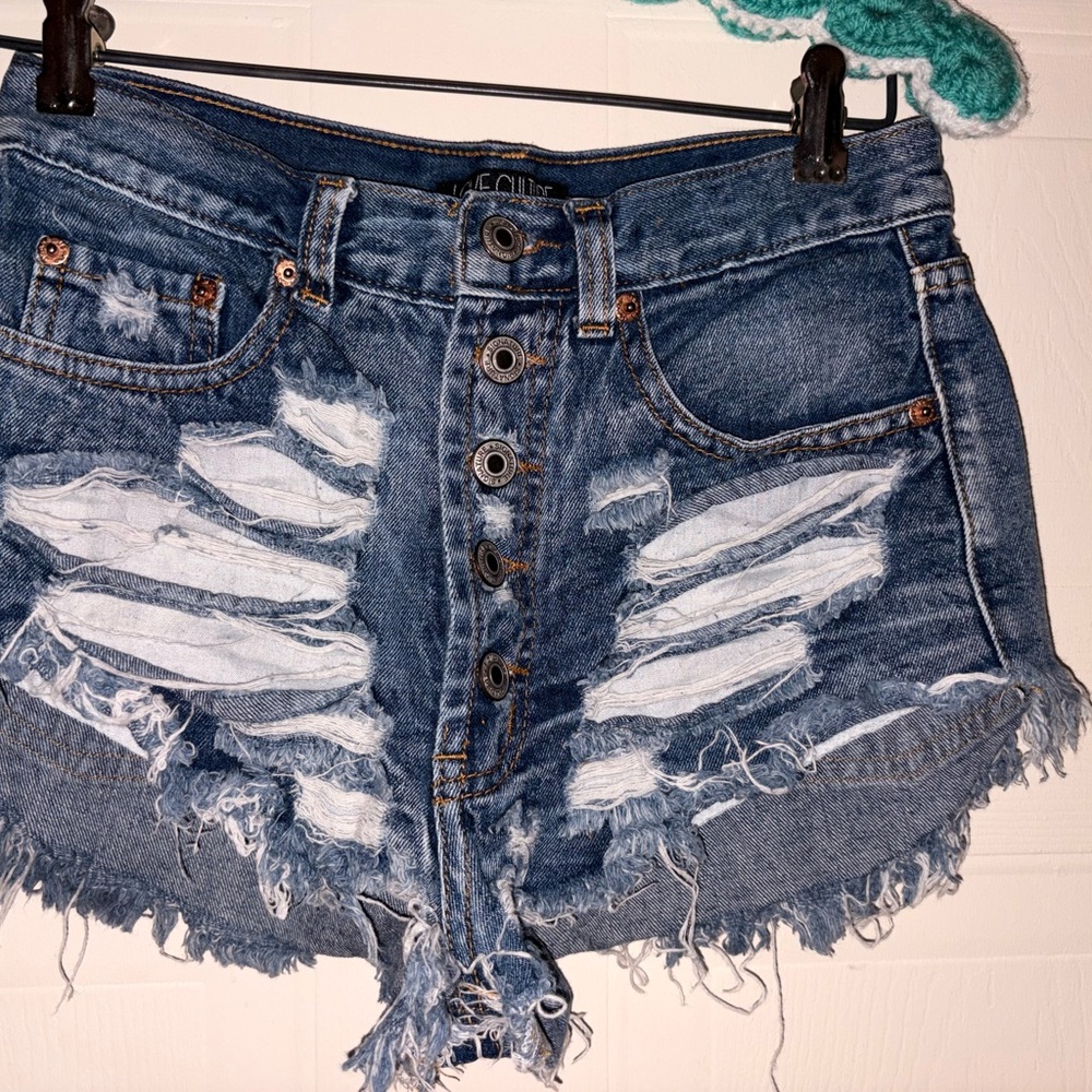 Love Culture Distressed Button-Fly Denim Cutoff Shorts in Dark Blue